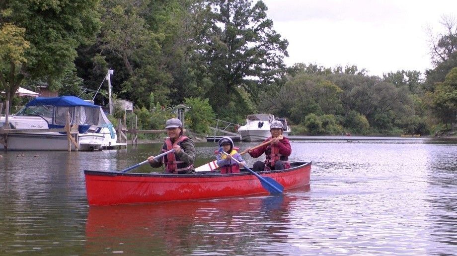 Family paddling at Humber by Canoe Event – Kings Mill Park, Toronto.