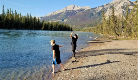 Skipping stones into the Athabasca River Photo: Grant Peregoodoff
