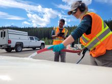 cleaning a boat at a watercraft inspection station